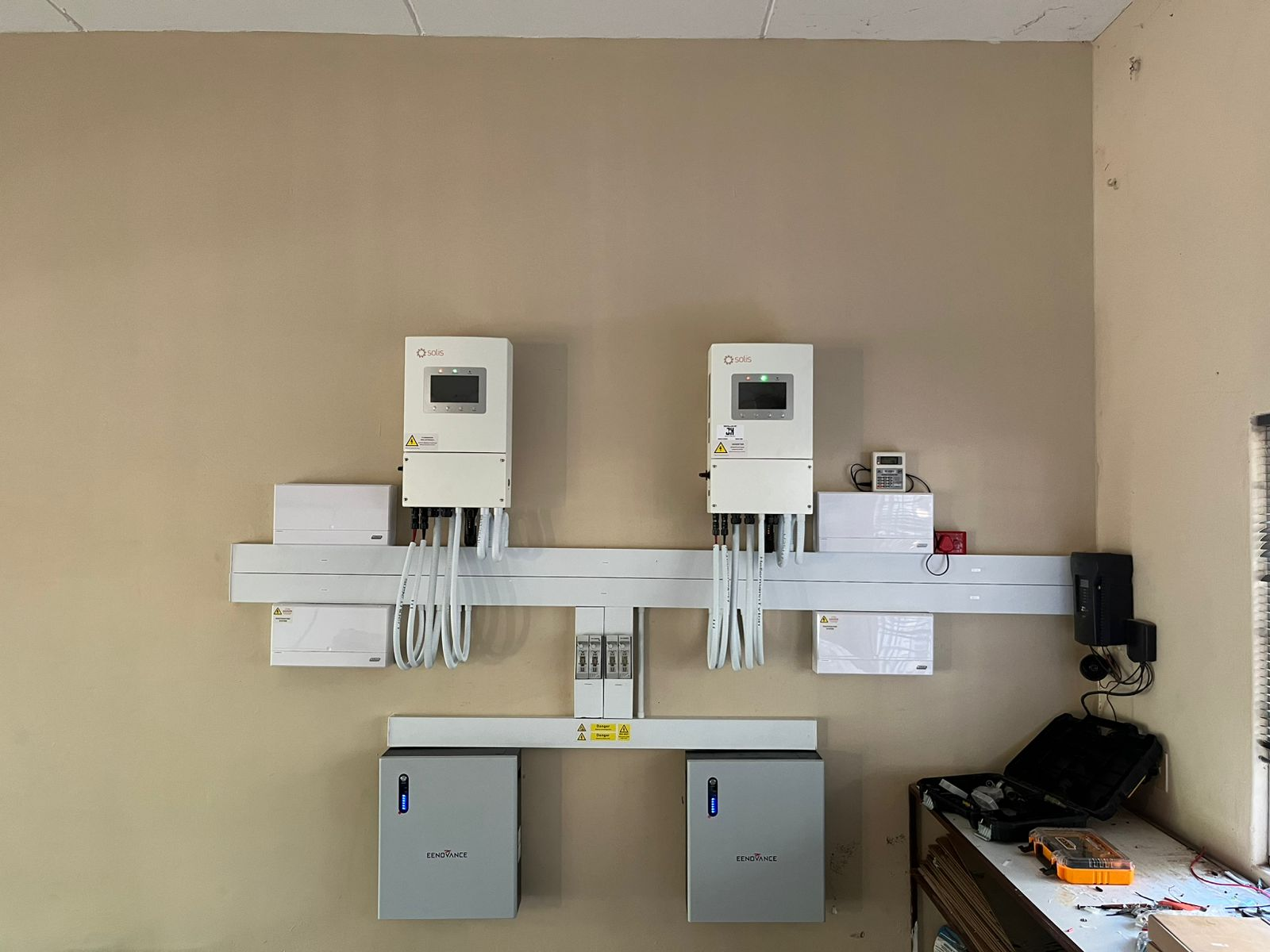 Dual inverter and battery wall installation for backup power